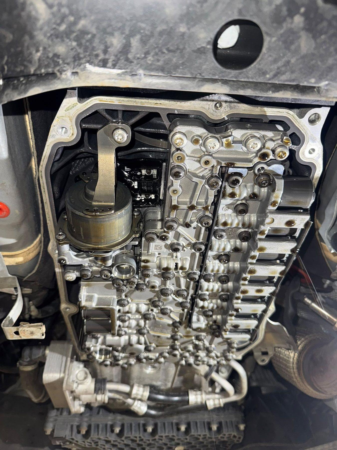 Valve body and mechatronic assembly exposed beneath a vehicle