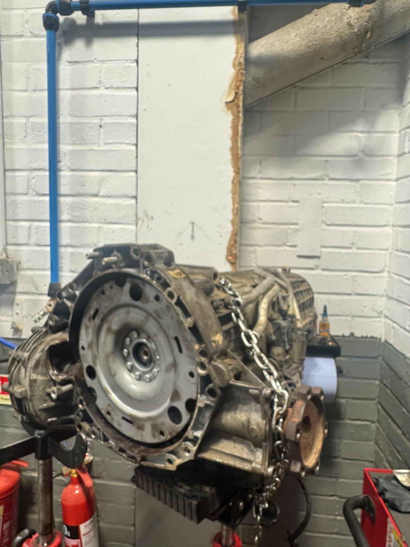 Removed gearbox secured to garage lifting equipment