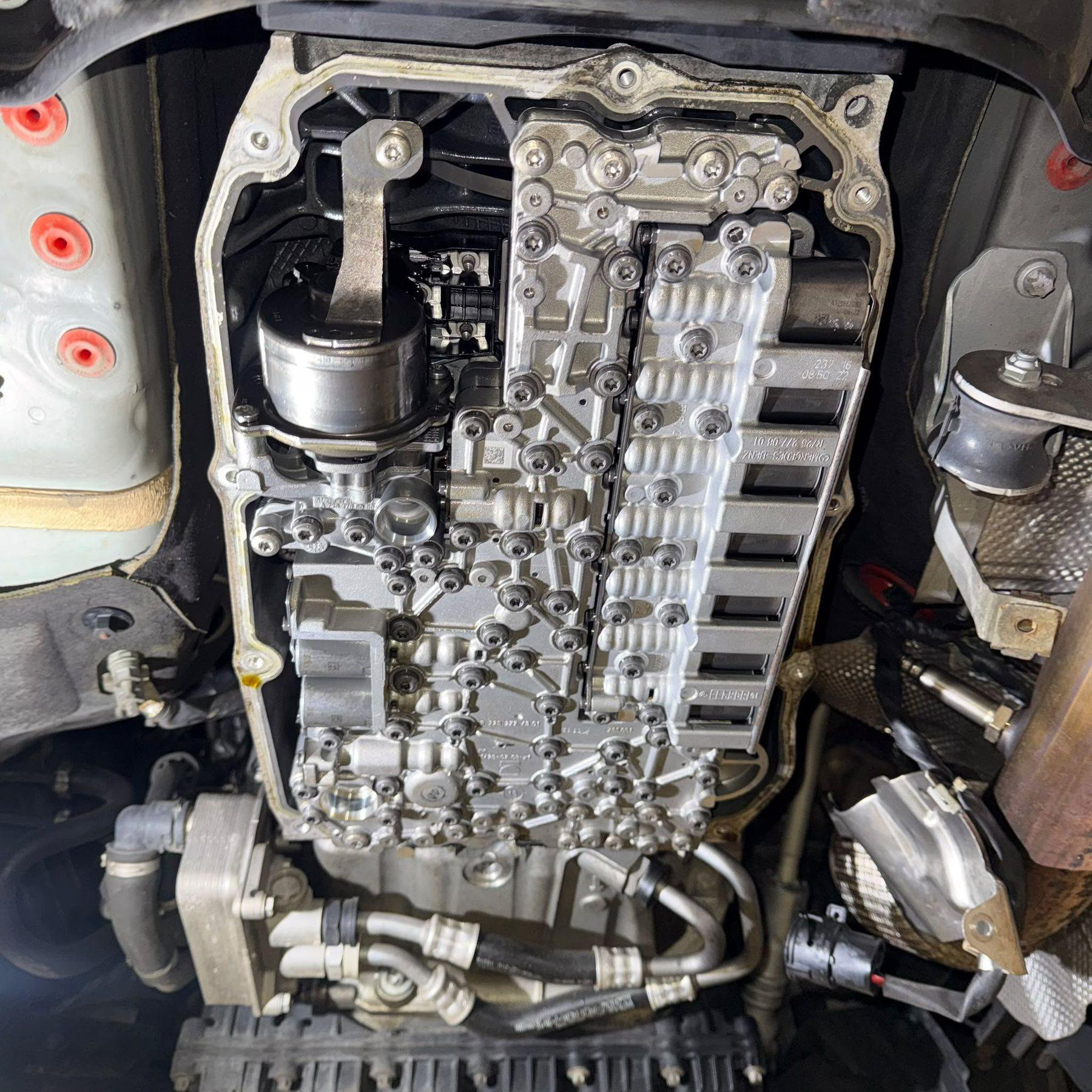 Transmission valve body exposed beneath a vehicle