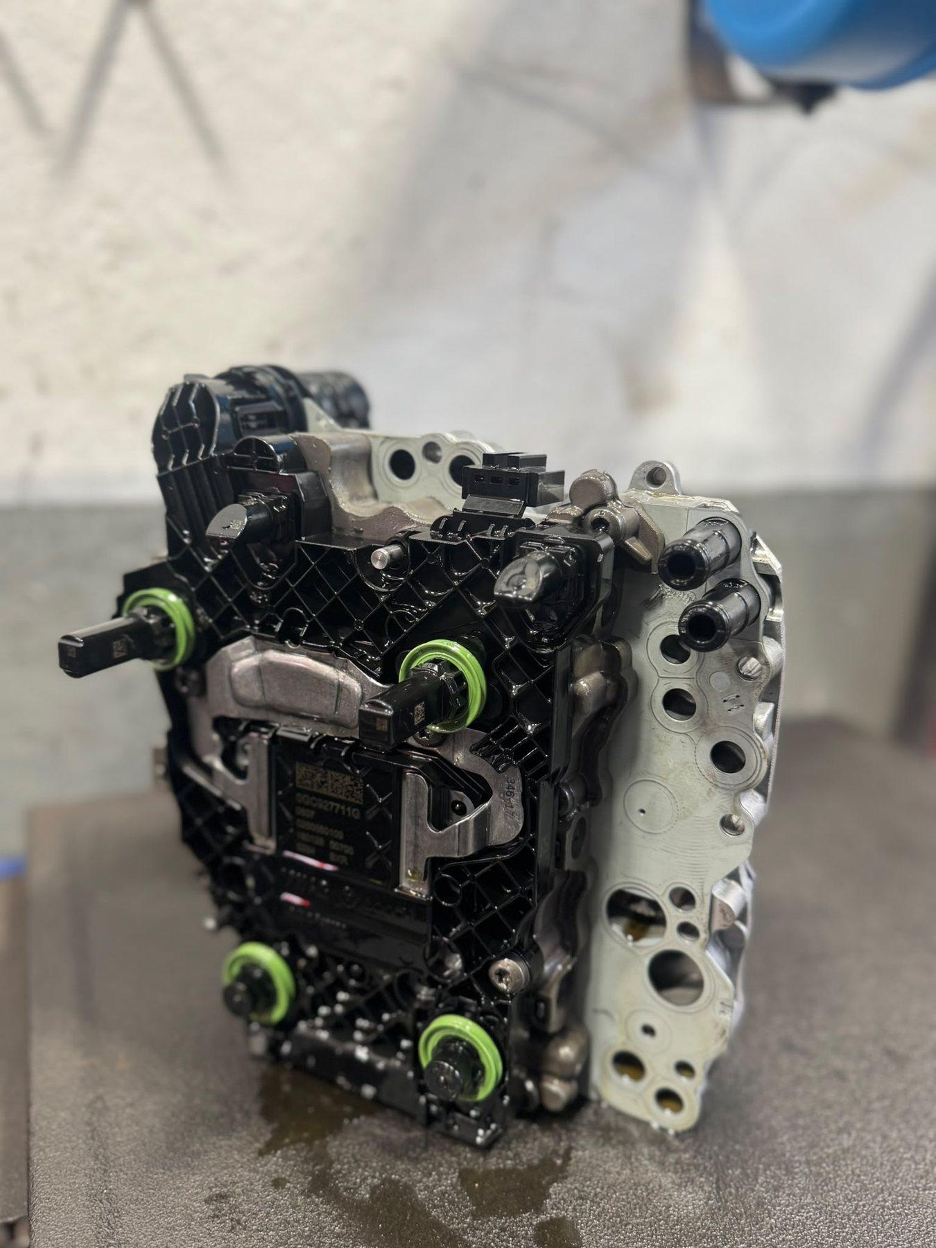 Mechatronic control unit standing on a garage workbench