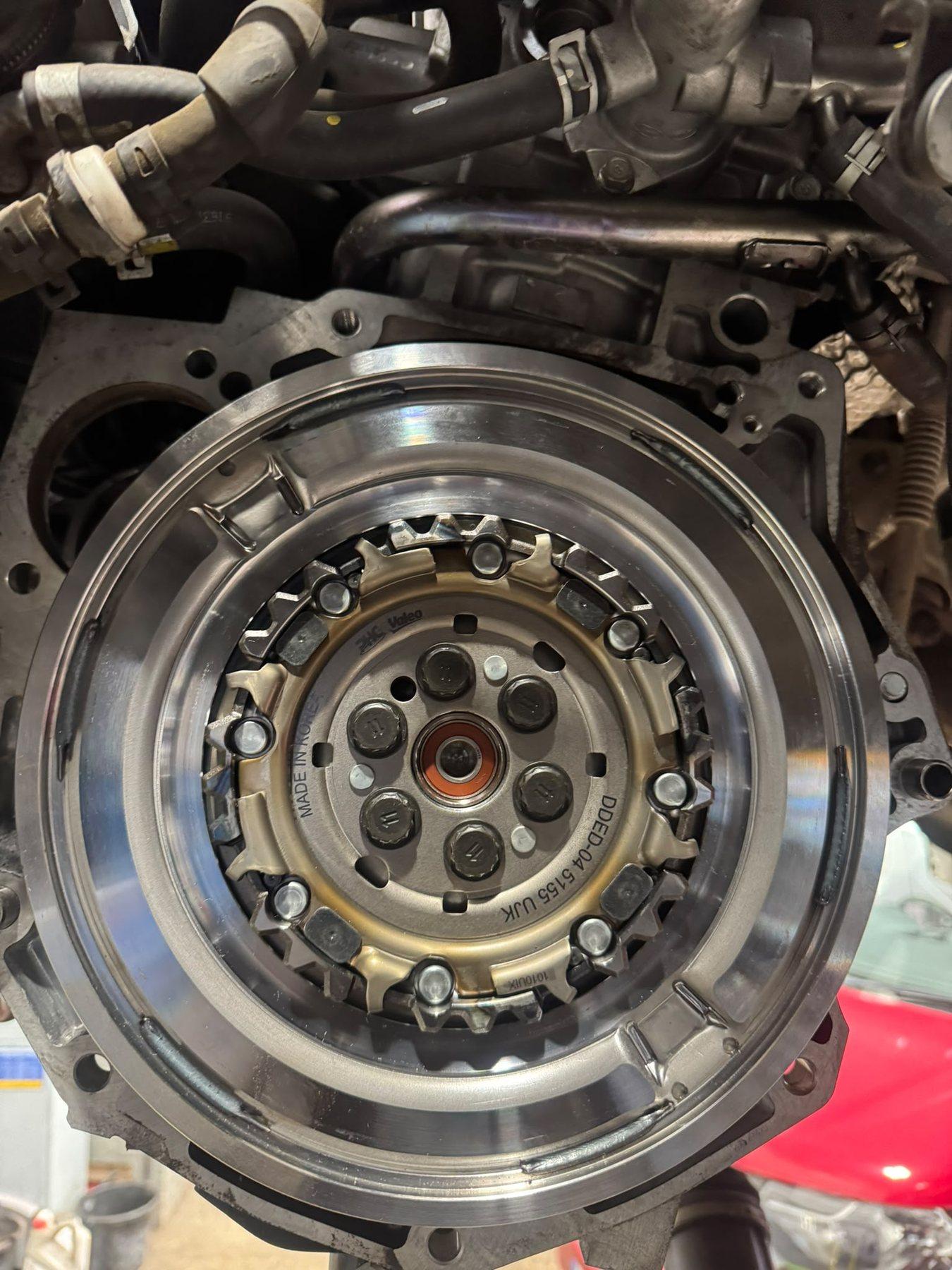 Clutch and flywheel assembly installed on a vehicle