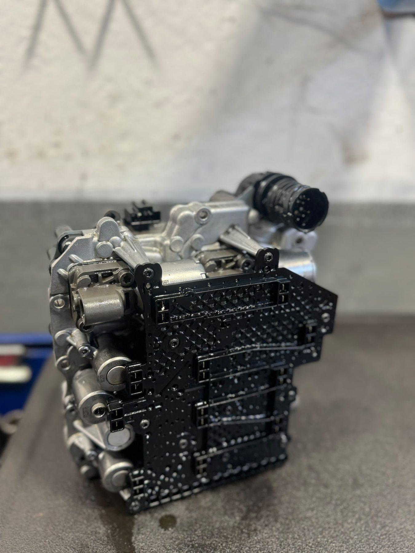 Mechatronic unit photographed on a clean garage workbench