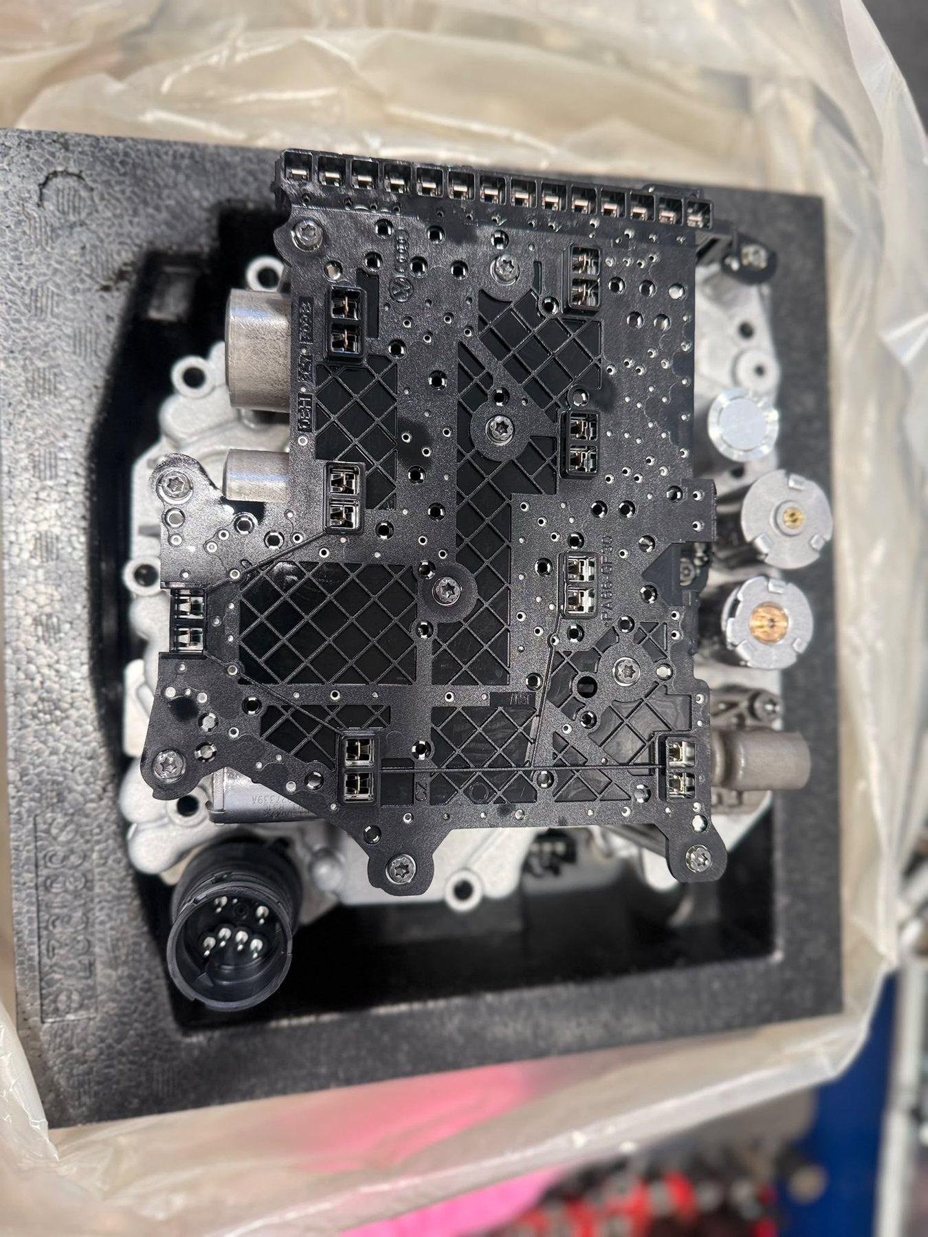 Black transmission control component with its fasteners and casing visible